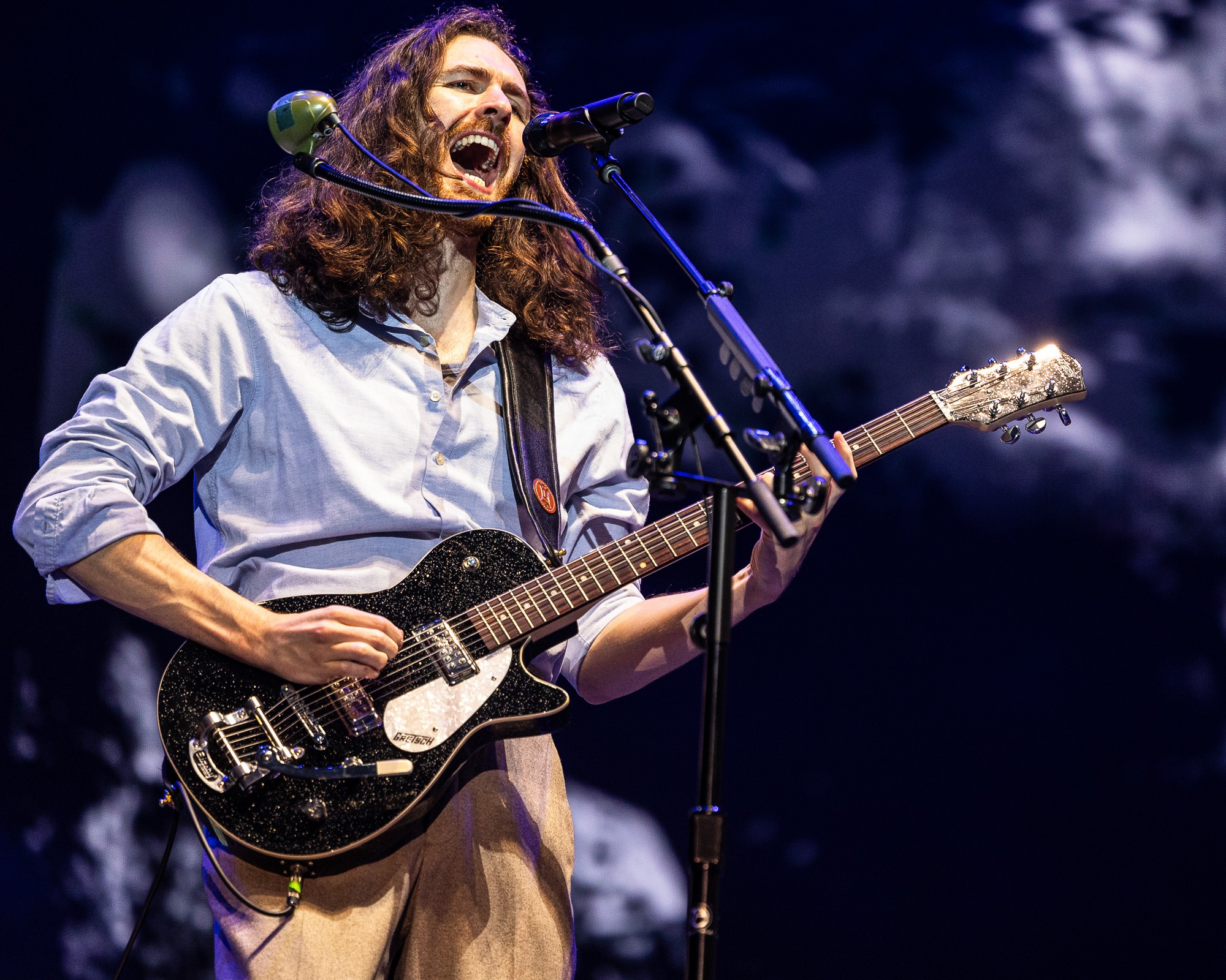 Hozier singing and playing guitar